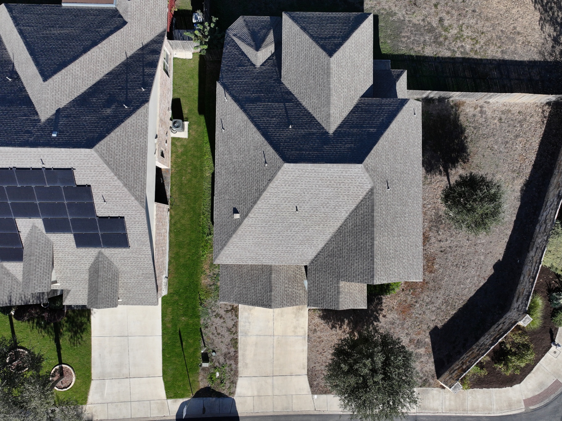 Aerial drone photograph of a Texas residential roof documented by Dustin Michael Drozd for an inspection report.